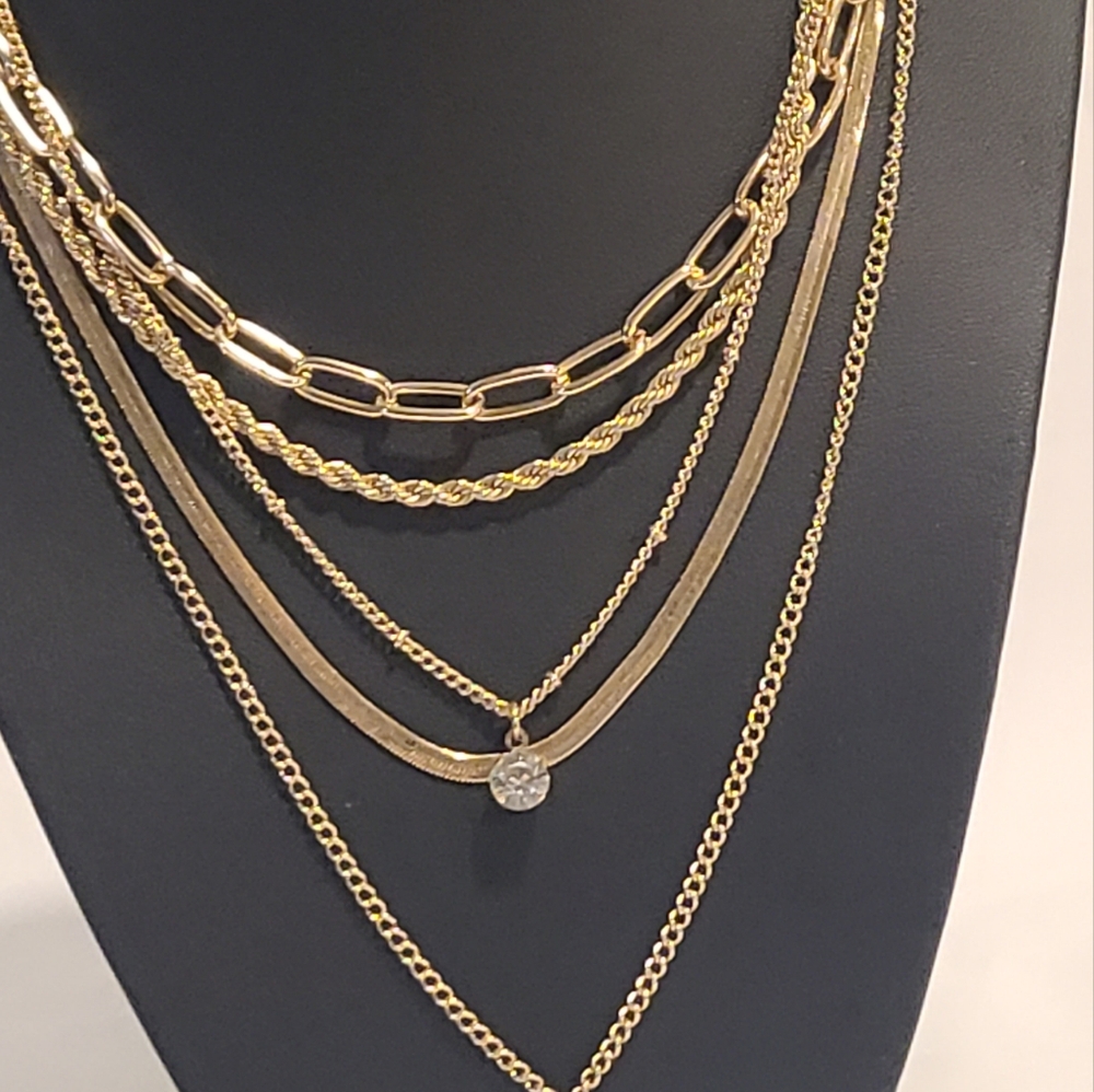 Two gold tone necklaces